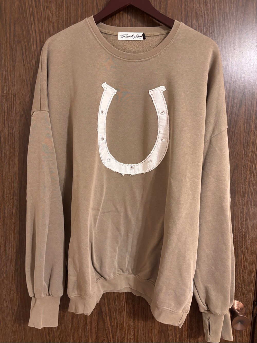 The Laundry Room Tan Crewneck Sweatshirt with White Horseshoe Appliqué